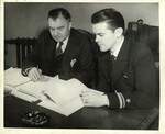 Photograph of Chief Justice Robert O. Jackson and Professor Thomas F. Lambert seated at a table at the Nuremberg trials, 1946 by Unknown
