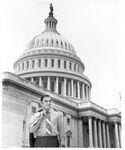 John Joseph Moakley standing in front of the United States Capitol, 1970s by Consolidated News Pictures