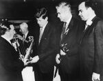 John E. Powers presenting harp to John F. Kennedy with John Joseph Moakley and Tip O'Neill, 1960s by unknown