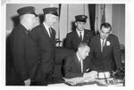 Bill signing with Boston firemen and Governor Foster Furcolo, 11 April 1960 by unknown