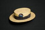 Straw hat with "Put Joe Moakley in Congress" button attached to it by unknown