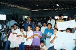 Children holding signs at an event in El Salvador, November 1999 by unknown