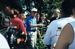 John Joseph Moakley and James P. McGovern speaking to a group in a field in El Salvador, 13 November 1999 by unknown