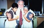 John Joseph Moakley in kitchen with Salvadoran women, 1997 by unknown