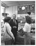 Public relations photograph in supermarket of John Joseph Moakley and staffer Deborah Spriggs (#1), 1980s by unknown