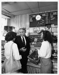 Public relations photograph in supermarket of John Joseph Moakley and staffer Deborah Spriggs (#2), 1980s by unknown