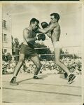 John Joseph Moakley, a.k.a. the "Boston Bull" (on the left) boxing in outdoor ring, circa 1947 by Cox Photo