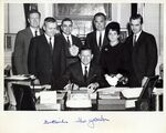 John Joseph Moakley (third from right) and William M. Bulger (second from left) at Governor John Volpe (seated) bill signing ceremony, photograph is signed by the governor by unknown