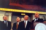 James Kelly, John Joseph Moakley (right, behind podium) and William M. Bulger (second from right) on the stage at Moakley's Silver Jubilee event at Faneuil Hall by unknown