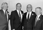 Senator Edward M. Kennedy, unidentified man, John Joseph Moakley, and William Bulger at an event by unknown