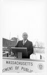 Central Artery/Third Harbor Tunnel groundbreaking ceremony, John Joseph Moakley speaking behind podium and Massachusetts Department of Public Works sign by Leslie N. Hilton