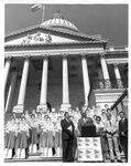 John Joseph Moakley, Fawn Evenson and others on the Capitol steps at a Support of the Textile Act Rally, 1980s by unknown