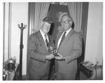 John Joseph Moakley receives an award from a veteran, 1980s-1990s by unknown