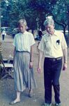 A man and a woman visit a rural village in El Salvador by unknown